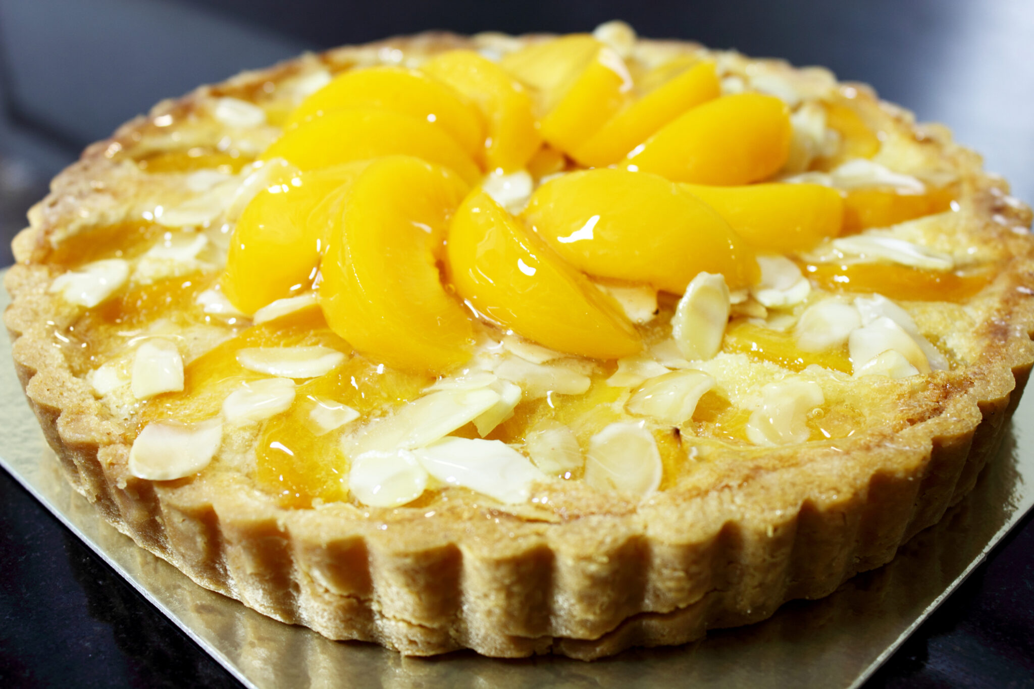 Réaliser une tarte amandine à la pêche, étape par étape